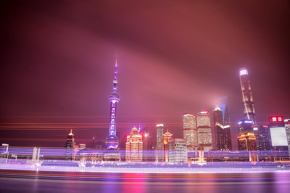 Shanghai's illuminated skyline at night, showing the contrast between modern infrastructure and digital complexity