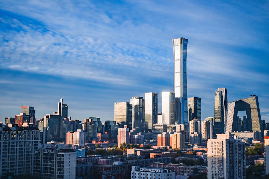 Beijing CBD skyline under a clear blue sky, contrasting with historical smog images