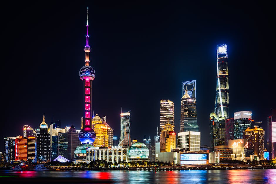 View of the Shanghai Lujiazui skyline on a rainy day seen through a window.