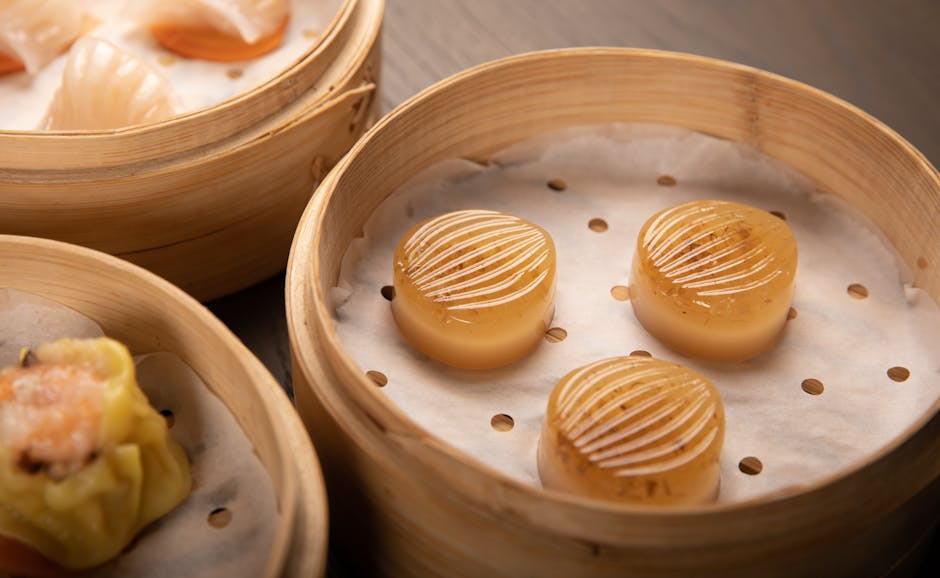 Traditional Cantonese tea set with steam rising, showing the teapot lid flipped open