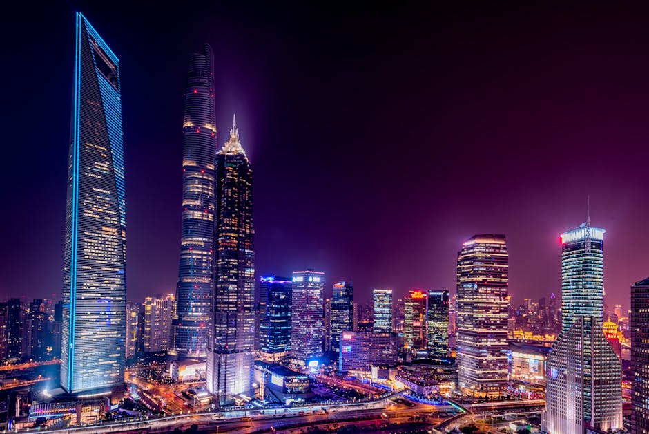 Shanghai's Lujiazui skyline illuminated at night, viewed from the Bund.
