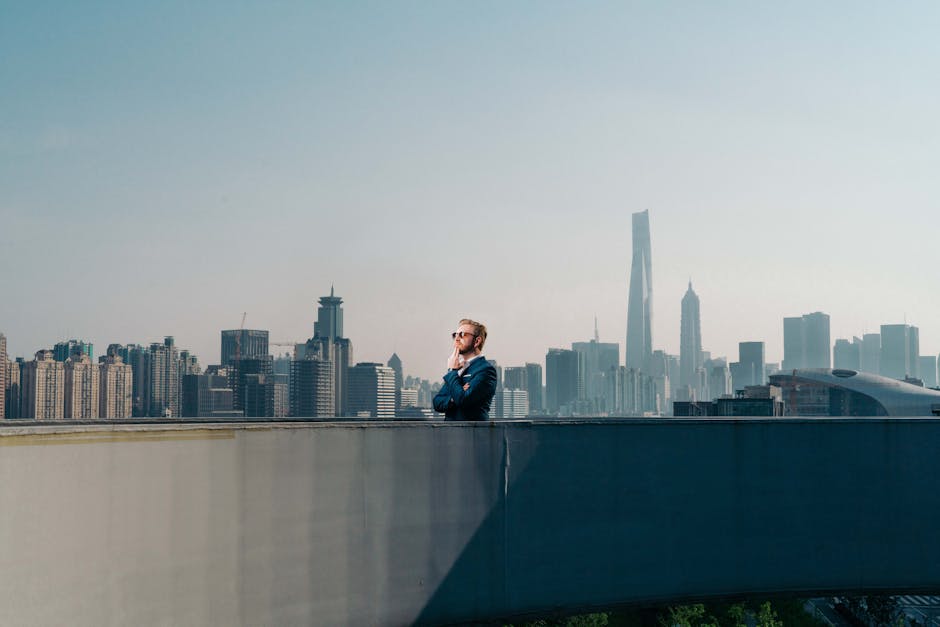 Expats networking at a rooftop event in Shanghai with the Bund skyline in background