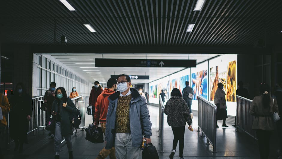 Crowds transferring at Longyang Road Metro station Shanghai with luggage