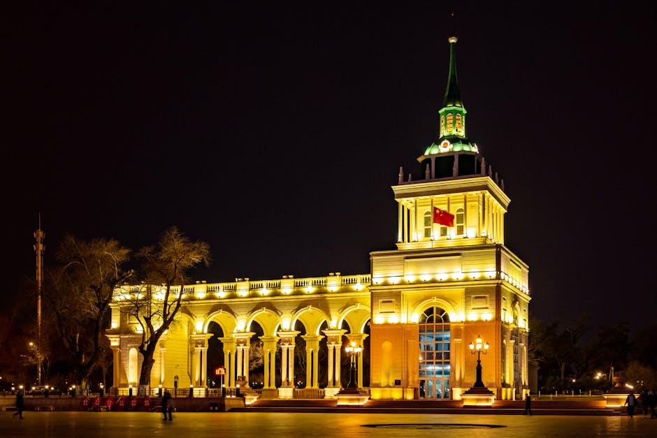 Close up of a Madier popsicle being held up against the backdrop of lights on Central Street