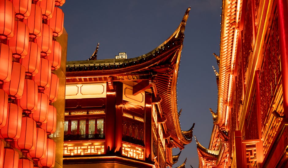Crowds gathering under the glow of traditional lanterns at Shanghai's Yu Garden